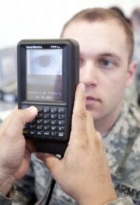 Pfc. Jason McCune sits while his iris is scanned during a biometrics class. (U.S. Army photo by Staff Sgt. Lewis Hillburn/Released)