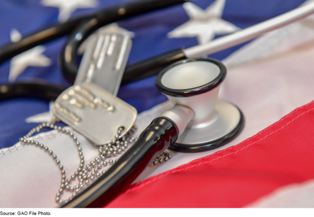Stethoscope and dog tags laying on a Flag of the United States.