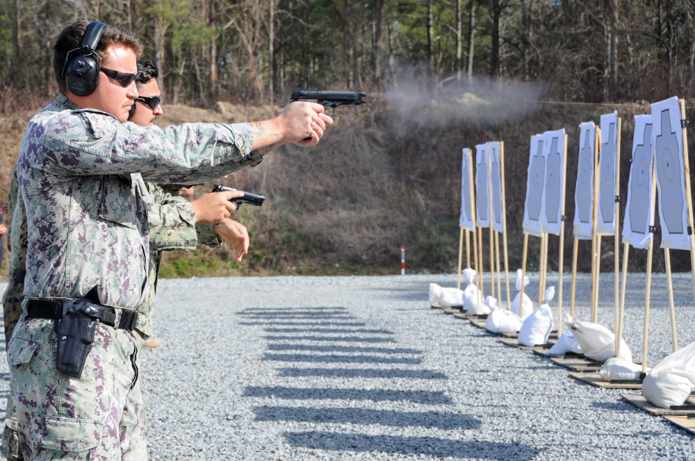 3 Military Personnel participating in firearms training