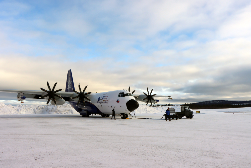 Large aircraft being prepared for its first mission in the Sub-Arctic region.