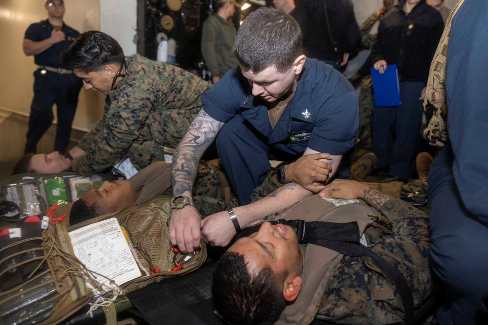 Military Personnel perform mass casualty exercise.