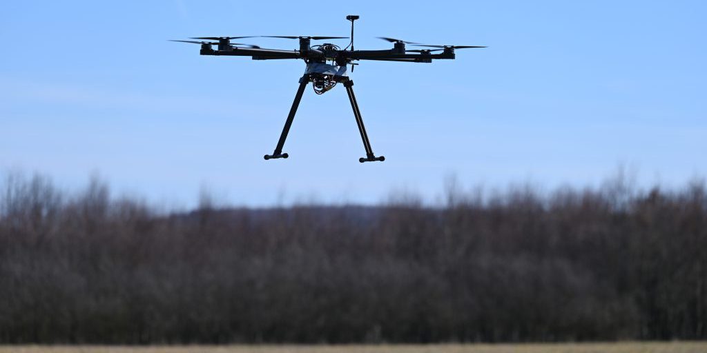An unmanned aerial system hovers in the air during a Georgia Tech Research Institute flight test in preparation for a Combined Joint All-Domain Command and Control demonstration in a field near Ramstein Air Base, Germany on February 21, 2021. U.S. Air Forces in Europe conducted a CJADC2 demonstration to highlight the Force’s ability to integrate network solutions and connect multiple sensors to a common operating network, presenting Warfighters with an information advantage across all Warfighting domains (U.S. Air Force photo by Tech. Sgt. Christopher Ruano).