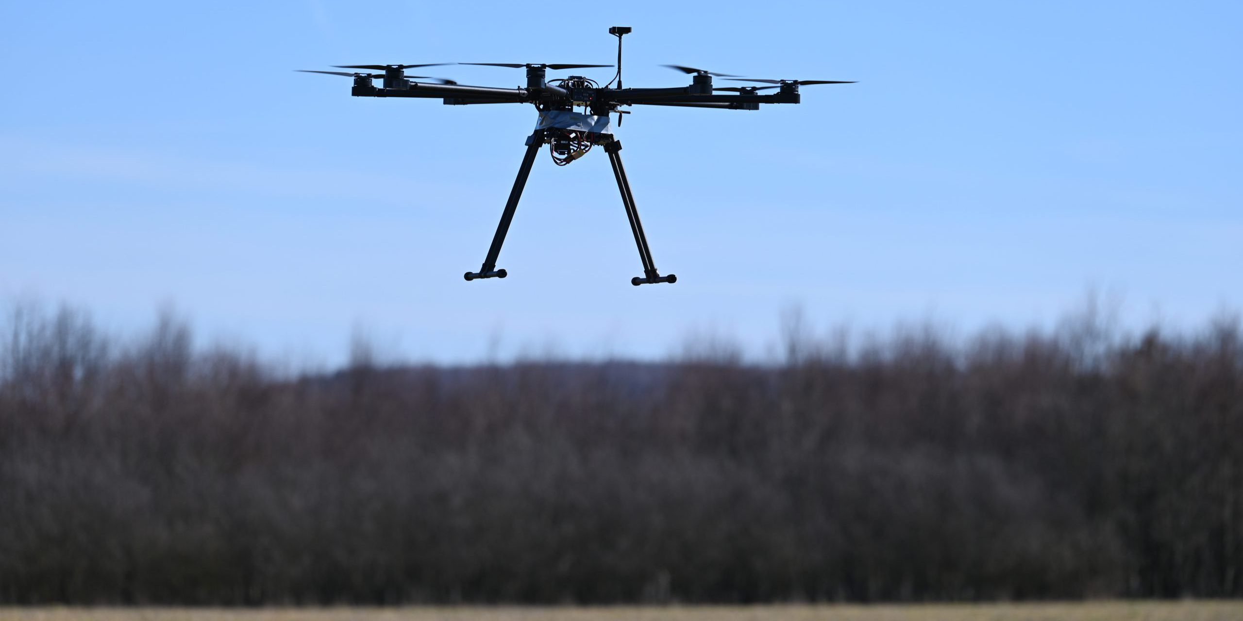 An unmanned aerial system hovers in the air during a Georgia Tech Research Institute flight test in preparation for a Combined Joint All-Domain Command and Control demonstration in a field near Ramstein Air Base, Germany on February 21, 2021. U.S. Air Forces in Europe conducted a CJADC2 demonstration to highlight the Force’s ability to integrate network solutions and connect multiple sensors to a common operating network, presenting Warfighters with an information advantage across all Warfighting domains (U.S. Air Force photo by Tech. Sgt. Christopher Ruano).