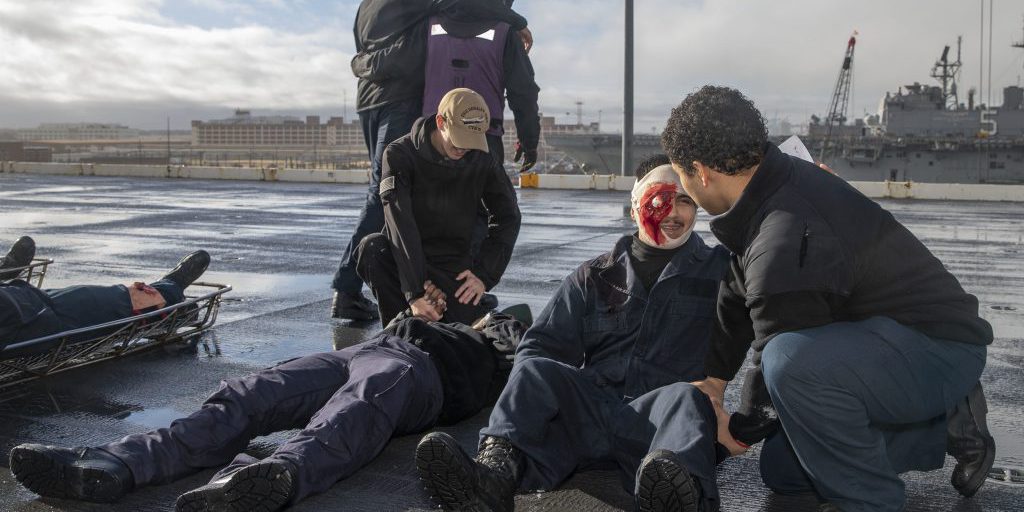 Sailors assigned to USS Gerald R. Ford (CVN 78) participate in a simulated mass casualty training event, March 17, 2022. Ford is in port at Naval Station Norfolk executing a tailored basic phase prior to the ship’s first operational deployment (U.S. Navy photo by Mass Communication Specialist 2nd Class Nolan Pennington).