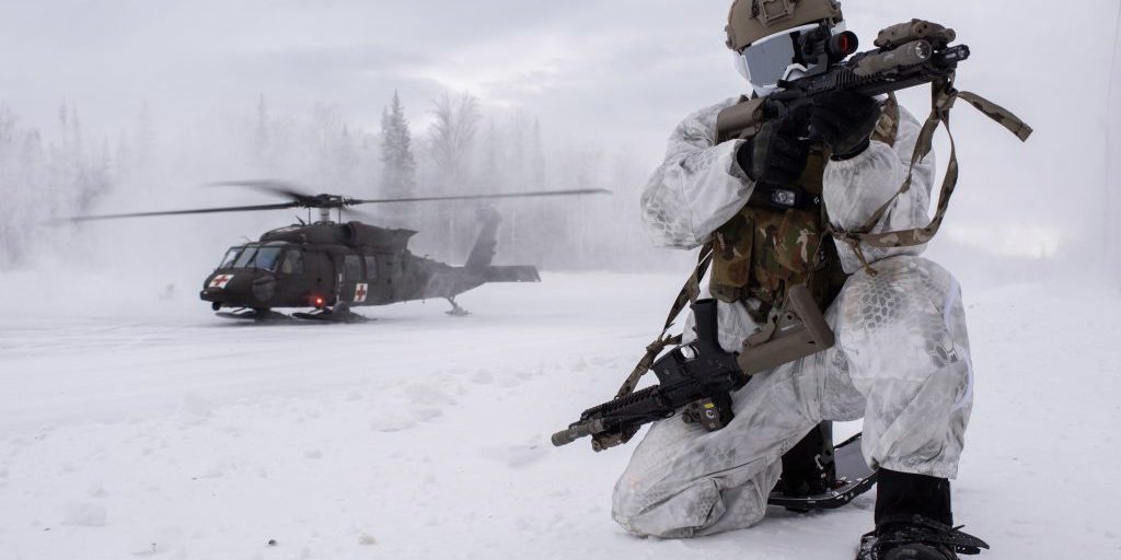 A special tactics airman provides security while an Alaska Army National Guard Black Hawk helicopter lands behind him during an arctic training exercise at Camp Mad Bull, Joint Base Elmendorf-Richardson, Alaska, January 10, 2023 (source:  U.S. DoD).