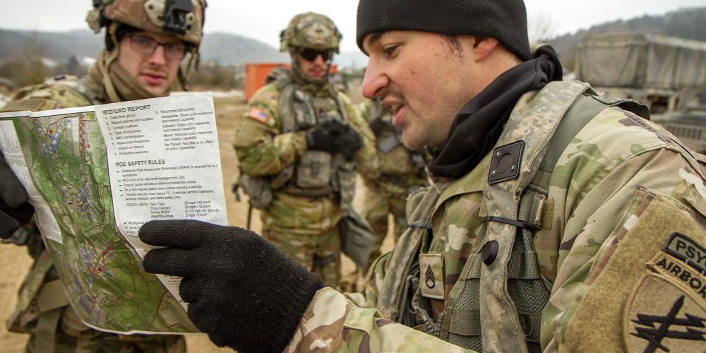 Staff Sgt. Dylan Ruefle, 25, of Pittsburgh, Penn., a noncommissioned officer from the U.S. Army Reserve’s 303rd Psychological Operations Company, briefs U.S. and Hungarian Soldiers prior to a mission during Allied Spirit 22 in the Joint Multinational Readiness Center training area near Hohenfels, Germany (U.S. Army).