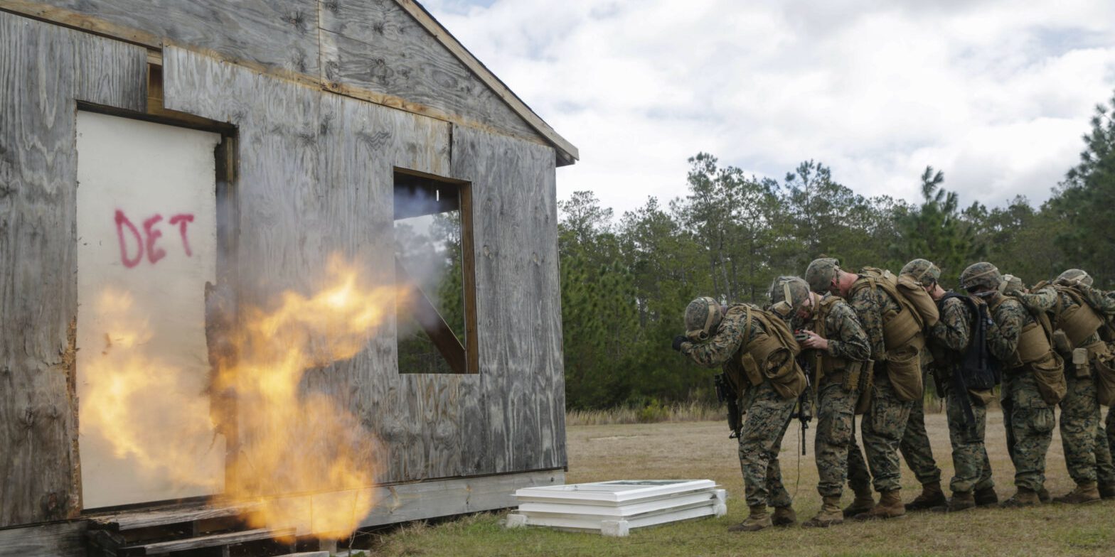 U.S. Marines from different units detonate a breaching charge during an urban breaching range at Camp Lejeune, N.C., March 20, 2018. Marines from both 2nd Combat Engineer Battalion and 3rd Battalion, 6th Marine Regiment, 2nd Marine Division conducted the training together to further improve proficiency in creating and using explosive breaching charges as well as improving unit cohesion. (U.S. Marine Corps photo by Lance Cpl. Leynard Kyle Plazo)