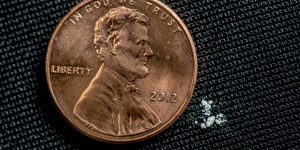 A photo illustrating 2 milligrams of fentanyl, a lethal dose for most people, compared to a penny. Matthew Moorman, a Sandia National Laboratories researcher, has developed a new method to detect tiny amounts of fentanyl analogs based on their common molecular structures. (Photo courtesy of the Drug Enforcement Administration)