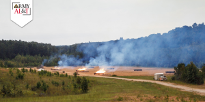 Inoperable ammunition being burned in an outdoor field.