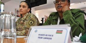 Eunice Peneti, a wildlife ranger with International Fund for Animal Welfare, and Sgt. First Class Sierra Melendez, the joint public affairs noncommissioned officer in charge with U.S. Special Operations Command Africa (SOCAF) listens to opening remarks for the Women in Security Conference supported by SOCAF in Nairobi, Kenya, March 21, 2023