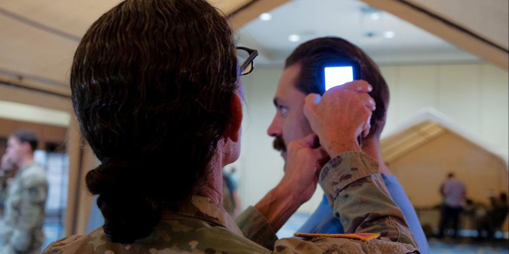 U.S. Army Lt. Col. Wendra Galfand, the Director of Medical Education and Research at Womack Army Medical Center, operates an intercranial hemorrhage assessment device during a soldier touchpoint event, Fort Liberty, N.C., Sept. 18, 2024. During the touchpoint, advanced developers with the U.S. Army Medical Materiel Development Activity and the North Carolina Center for Optimizing Military Performance gathered performance feedback from soldiers employing two brain trauma assessment devices currently under development at USAMMDA. USAMMDA develops, delivers, and fields critical drugs, vaccines, biologics, devices, and medical support equipment to protect and preserve the lives of Warfighters across the globe. USAMMDA project managers guide the development of medical products for the U.S. Army Medical Department, other U.S. military services, the Joint Staff, the Defense Health Agency, and the U.S. Special Operations community. The process takes promising technology from the Defense Department, industry, and academia to U.S. forces, from the testing required for U.S. Food and Drug Administration approval or licensing to fielding and sustainment of the finished product (photo credit: U.S. Army photo by Cameron Parks).